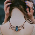 Necklaces - Woman Wears Gold-colored Blue Gemstone Pendant Necklace