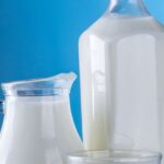 Products - Close-up of Milk Against Blue Background